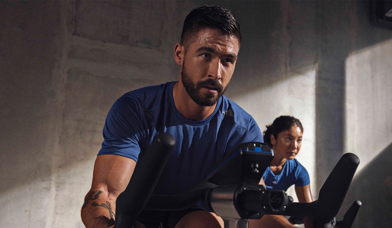 Two members take part in a Cycling class at a GoodLife Fitness club.