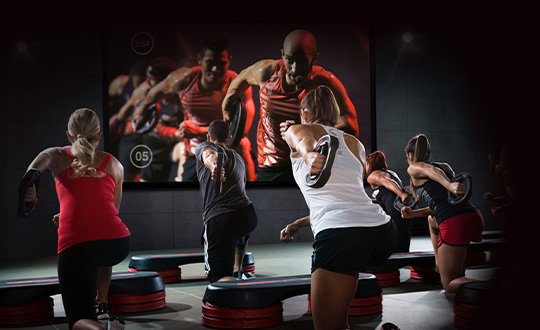 Touchscreen with different types of GoodLife workouts.