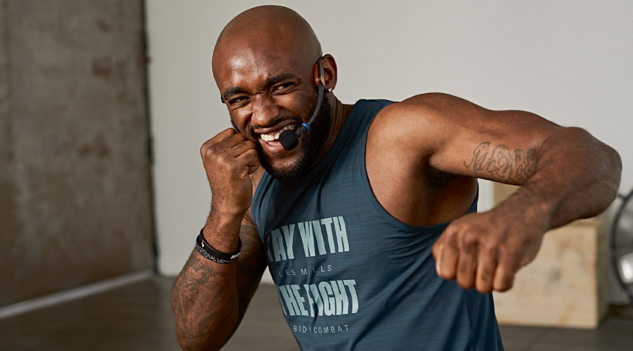 Man in red using battle ropes
